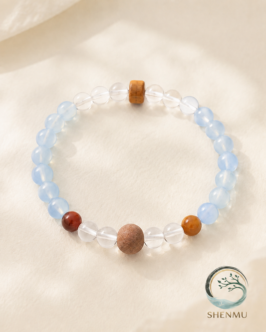 Still Voice aquamarine and highland incense bracelet on warm ivory background