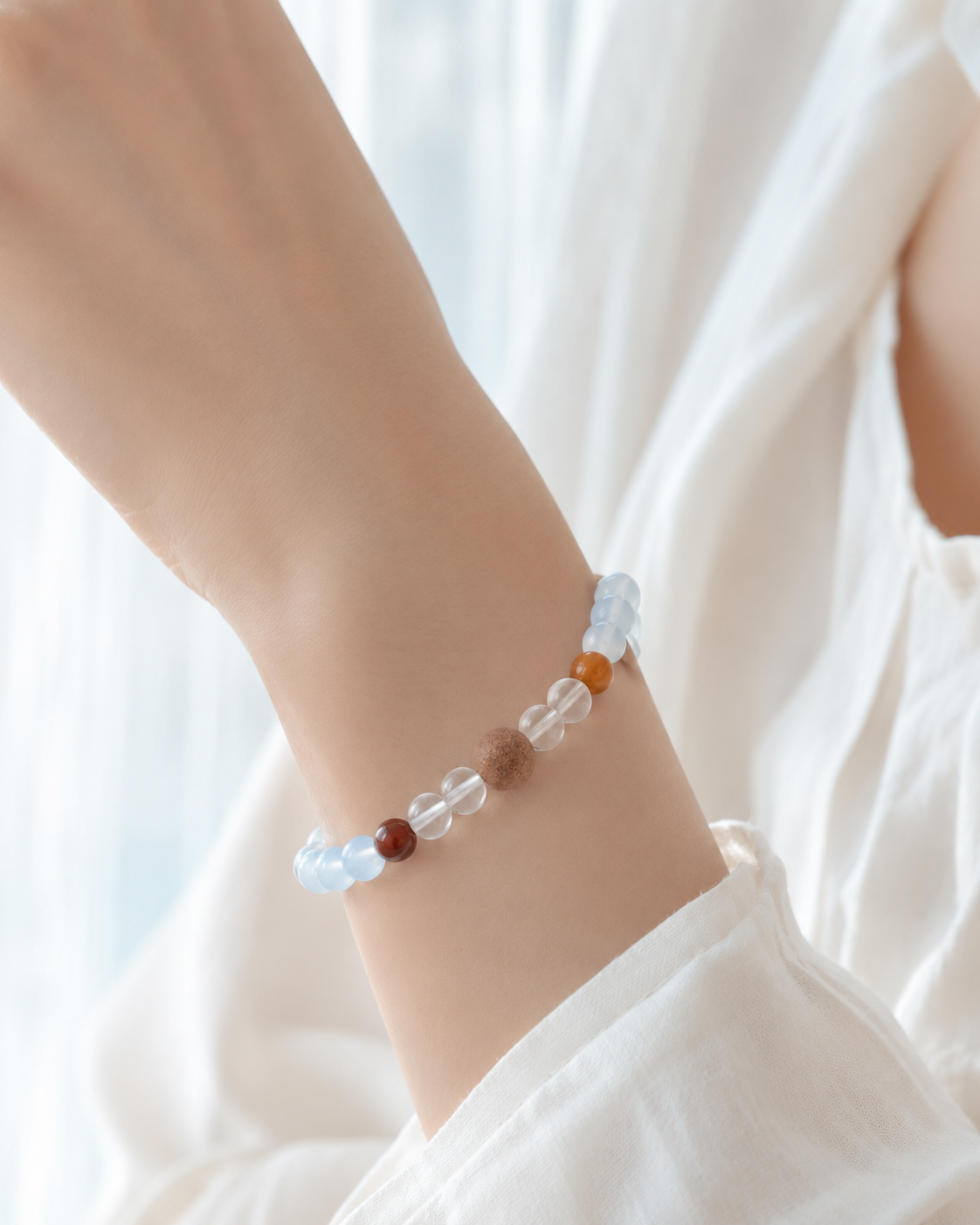 Still Voice aquamarine bracelet worn on wrist in soft natural light